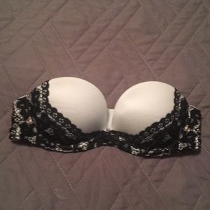 White strapless bra with black lace.